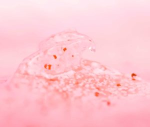 Exfoliator on a pink background