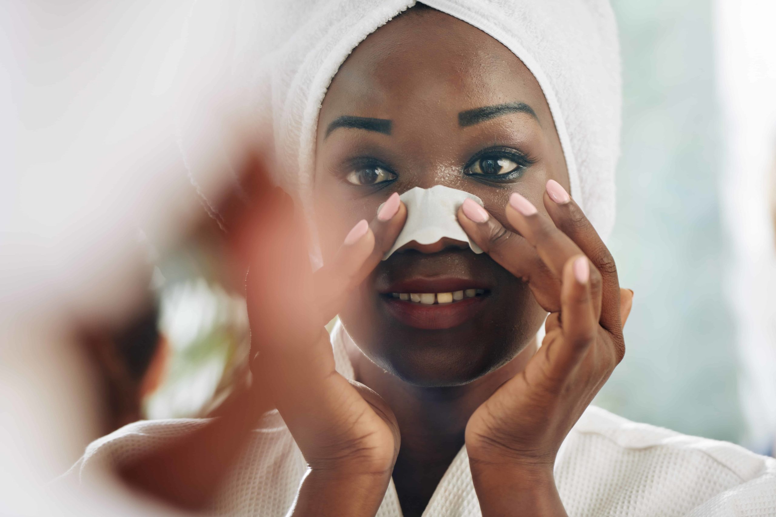 Woman applying a nose strip