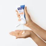 Thumbnail of Hand squeezing PanOxyl Balancing Repair Moisturizer on another hand