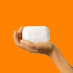 Thumbnail of Hand holding PanOxyl Acne Treatment Bar on an orange background