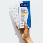 Thumbnail of Hand holding PanOxyl Aftercare Brightening Patches on a white background