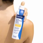 Thumbnail of A person holding a bottle of PanOxyl Acne Banishing Body Spray over their back