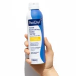 Thumbnail of A hand holding a bottle of PanOxyl Acne Banishing Body Spray on a white background