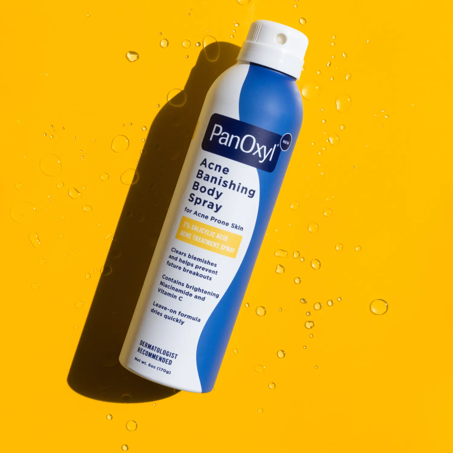 Aerosol bottle of PanOxyl Acne Banishing Body Spray on an orange background