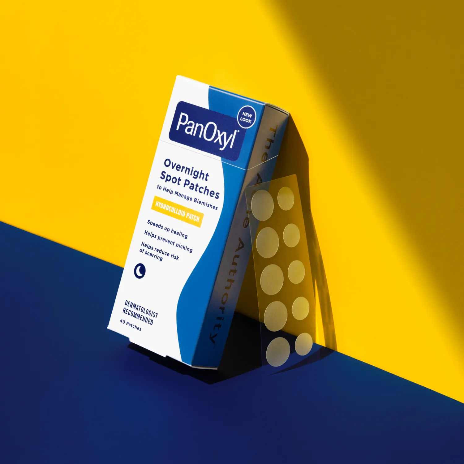 A box of PanOxyl overnight spot patches on a yellow and blue background.