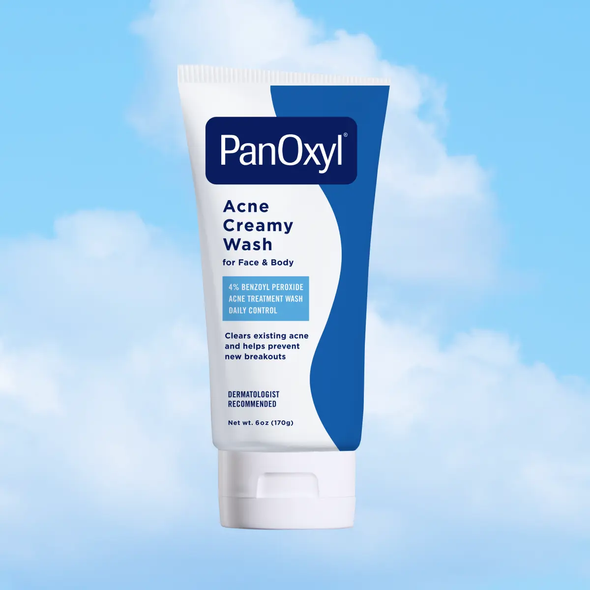 A tube of PanOxyl acne creamy wash on a sky background.